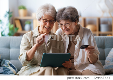 Women are doing online purchases Women are doing online purchases 129431654