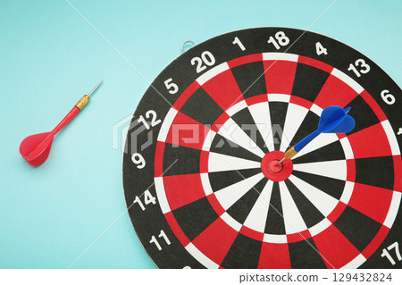 Dart board on light blue background. Top view 129432824