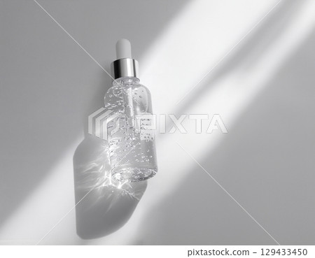 bottles with cosmetic cream on white 129433450