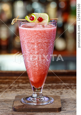 Cocktail in a tall glass at the bar 129433500