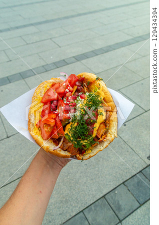 Tasty Gemuse Kebab in a man's hand. 129434394