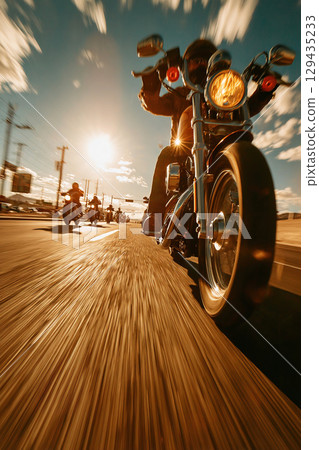 Modern bikers enjoy a group ride along the highway on a hot summer day Modern bikers enjoy a group ride along the highway on a hot summer day 129435233
