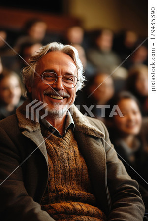 Professor engages with enthusiastic students during a lively lecture in a classroom 129435390