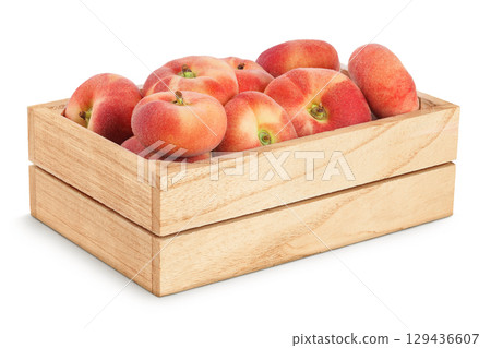 chinese flat donut peaches in wooden box isolated on white background chinese flat donut peaches in wooden box isolated on white background 129436607