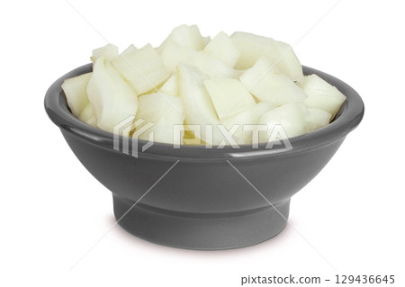 Onion slices in a ceramic bowl isolated on a white background 129436645