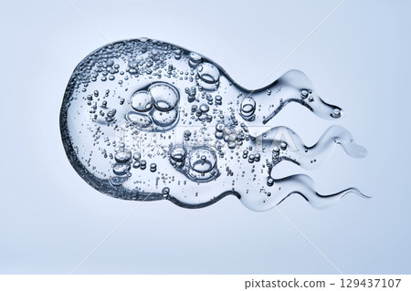 Delicious serum texture with bubbles on a blue background. 129437107