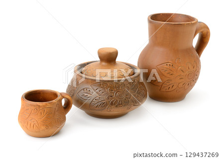 Clay jug, pot and cup isolated on white 129437269