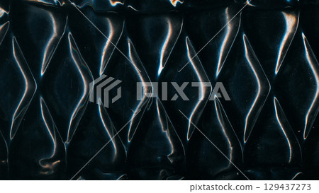 Metal uneven pattern. Old texture. Glossy steel diamond wave wall. Black distressed uneven old abstract defocused scratch background. 129437273
