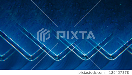 Geometric wave. Marble art. Defocused blue neon colorful sparkling ink glitter water cloud pigment floating on abstract background. Geometric wave. Marble art. Defocused blue neon colorful sparkling ink glitter water cloud pigment floating on abstract background. 129437278