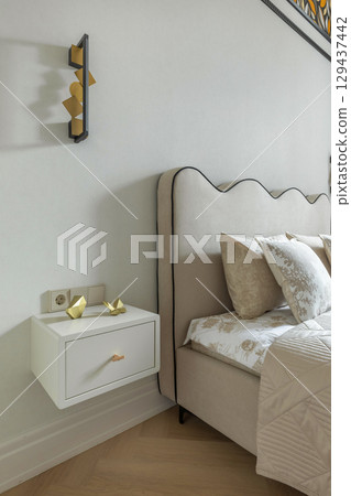 Elegant Bedside View with Minimalist Wall Sconce Elegant Bedside View with Minimalist Wall Sconce 129437442