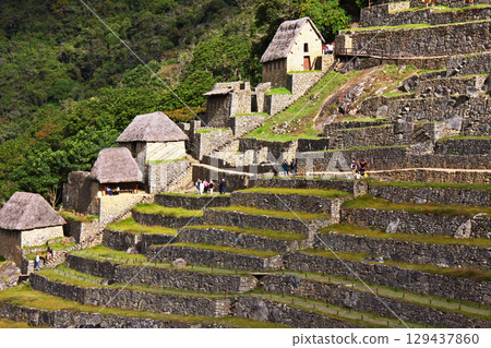 Stone walls and dwelling remains of Machu Picchu ruins, Peru, South America 129437860