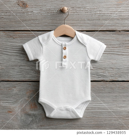 Adorable mockup baby onesie hanging in nursery minimalist design cozy environment inviting viewpoint 129438935