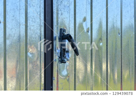 Broken lock after a burglary. Lock after a thief broke in. Insurance concept, risk of burglary, and security. Broken lock after a burglary. Lock after a thief broke in. Insurance concept, risk of burglary, and security. 129439078