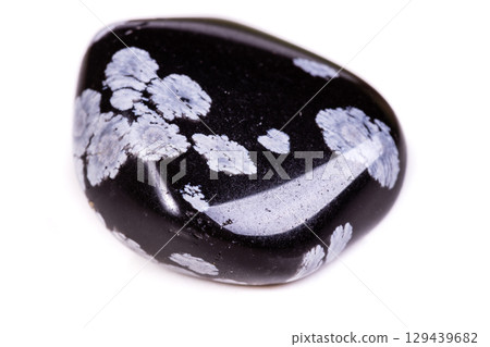 Macro mineral stone snow obsidian on white background 129439682