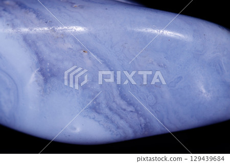 Macro mineral blue agate sapphirin in the rock on black background Macro mineral blue agate sapphirin in the rock on black background 129439684
