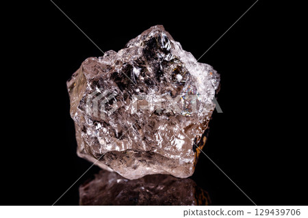 Macro mineral stone smoky quartz Rauch topaz on black background 129439706