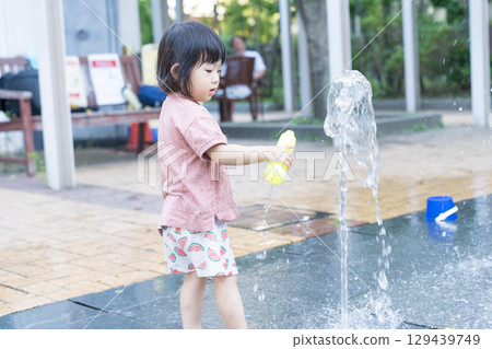 Japanese toddlers playing in the fountain at the apartment complex Japanese toddlers playing in the fountain at the apartment complex 129439749