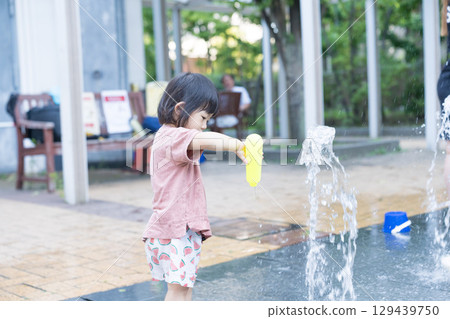 Japanese toddlers playing in the fountain at the apartment complex 129439750