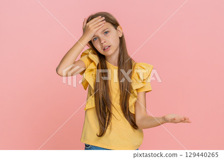 Child girl kid doing facepalm to show shame or disappointment in funny awkward imaginary situation 129440265