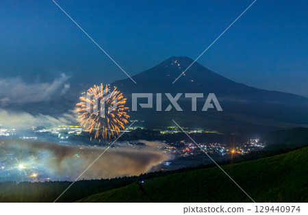 Mount Fuji illuminated by moonlight from the heights of Oshino and the fireworks of the Oshino Hakkai Festival 129440974