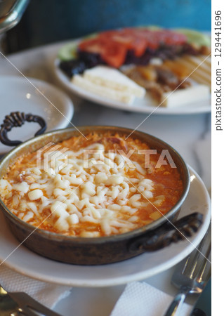 Delicious turkish menemen on a table  129441696