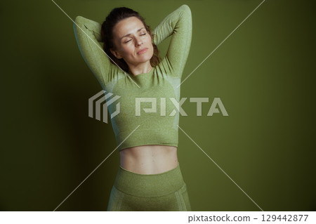 Green Serenity: Woman Stretching Green Serenity: Woman Stretching 129442877