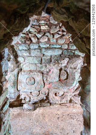 Intricate stone sculpture on a wall inside an archaeological excavation tunnel at the Mayan ruins of Copan, a UNESCO World Heritage site in Honduras Intricate stone sculpture on a wall inside an archaeological excavation tunnel at the Mayan ruins of Copan, a UNESCO World Heritage site in Honduras 129442908