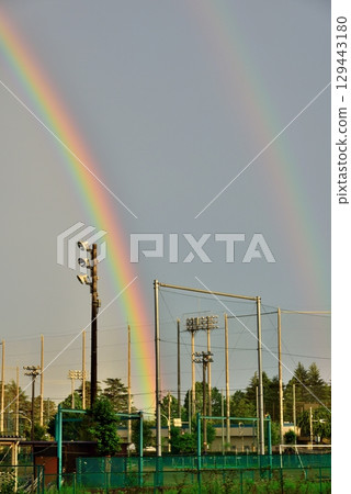 A vibrant rainbow in the sky after the rain in Akishima City 129443180