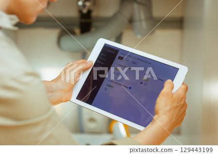 Plumbing Tasks on Tablet 129443199