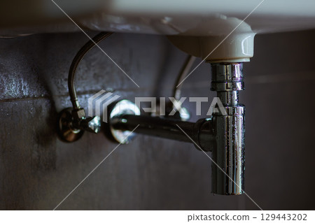 Chrome Plumbing Under Sink Chrome Plumbing Under Sink 129443202