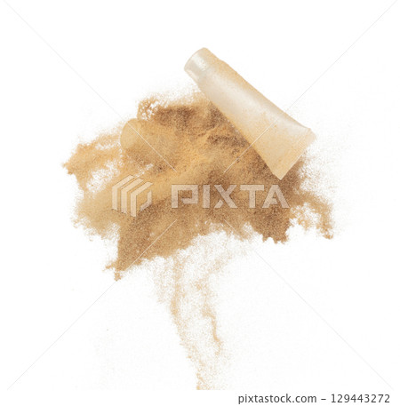 Cosmetic container white bottle fly splashing in mid air. Moisturizer lotion cream bottle explosion flying with sand powder dust under dry sun. White background isolated high speed shutter freeze Cosmetic container white bottle fly splashing in mid air. Moisturizer lotion cream bottle explosion flying with sand powder dust under dry sun. White background isolated high speed shutter freeze 129443272