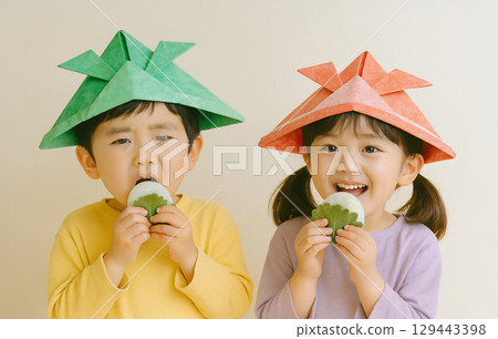 Boy and girl wearing paper helmets Children's Day 129443398