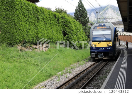 Bernese Oberland Railway arriving at Grindelwald terminal station 129443812