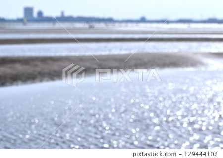Shallow beach at low tide Shallow beach at low tide 129444102