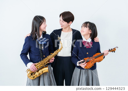 Music teacher and female student portrait 129444323