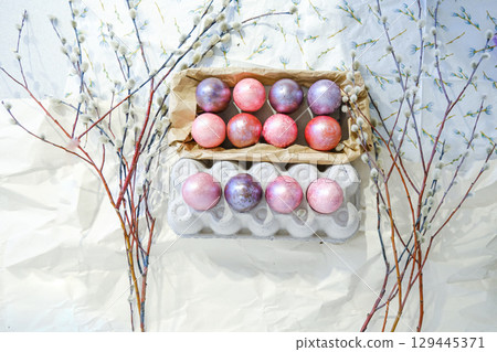 Close-up view of chicken eggs, homemade easter cake and willow twigs 129445371
