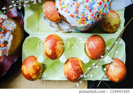 Close-up view of chicken eggs, homemade easter cake and willow twigs Close-up view of chicken eggs, homemade easter cake and willow twigs 129445385