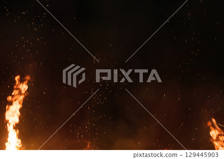 Beautiful background material texture with sparks of flame Beautiful background material texture with sparks of flame 129445903