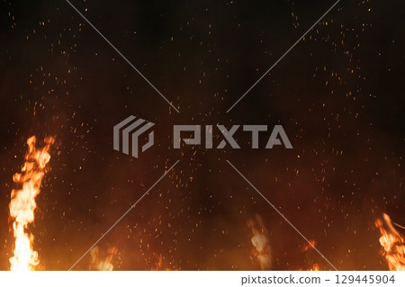 Background material texture of burning flame sparks on a black background Background material texture of burning flame sparks on a black background 129445904