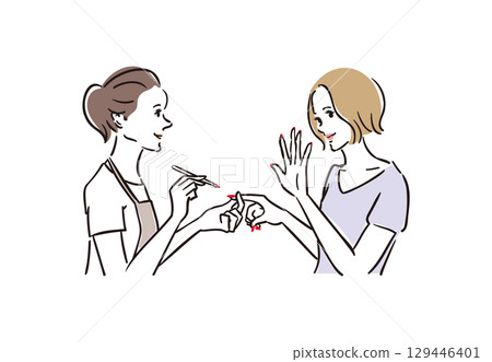 A woman happily receiving treatment at a nail salon A woman happily receiving treatment at a nail salon 129446401