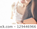 Woman combing her tangled hair 129446966