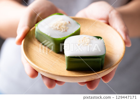 Traditional Thai dessert (Khanom Tako), Pudding with coconut cream topping in pandan leaf Traditional Thai dessert (Khanom Tako), Pudding with coconut cream topping in pandan leaf 129447171