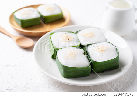Traditional Thai dessert (Khanom Tako), Pudding with coconut cream topping in pandan leaf Traditional Thai dessert (Khanom Tako), Pudding with coconut cream topping in pandan leaf 129447173