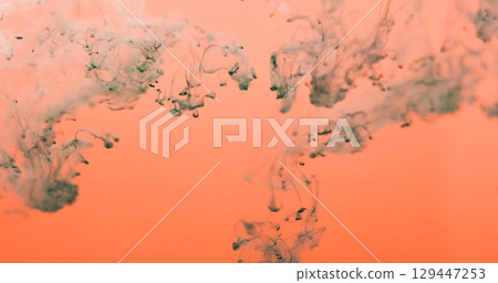 Ink vapor. Smoke blend. Gray fume paint drop curl stream in orange water. Art bright color abstract blur hot background spill haze. 129447253