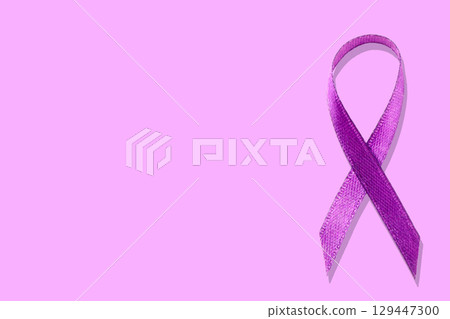 A vibrant purple ribbon symbolizes support for various health causes A vibrant purple ribbon symbolizes support for various health causes 129447300
