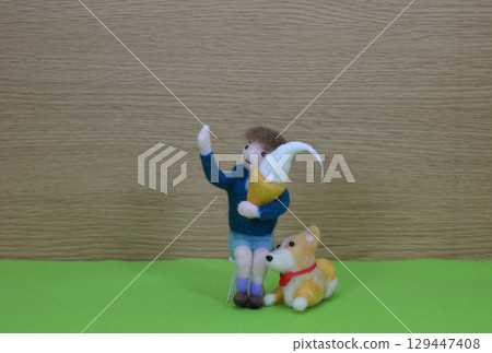 Child and dog holding soft serve ice cream 129447408