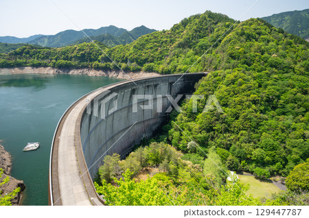 Arch dam with fresh greenery Arch dam with fresh greenery 129447787
