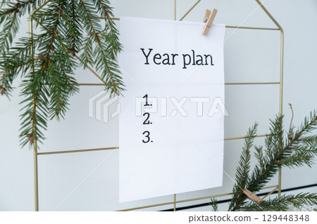 YEAR PLAN list paper note on Dream board promises and aims. Preparation for new year new life new me. Visualizing wish list for 2025. Dreams plan action for coming year. Inspirational self improvement YEAR PLAN list paper note on Dream board promises and aims. Preparation for new year new life new me. Visualizing wish list for 2025. Dreams plan action for coming year. Inspirational self improvement 129448348