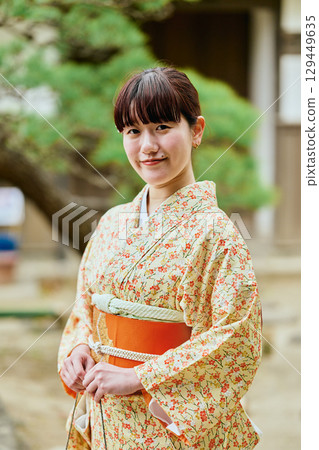Young lady in kimono Young lady in kimono 129449635