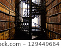 Spiral staircase and bookshelves in the Long Room of Trinity College, Dublin (Ireland) 129449664